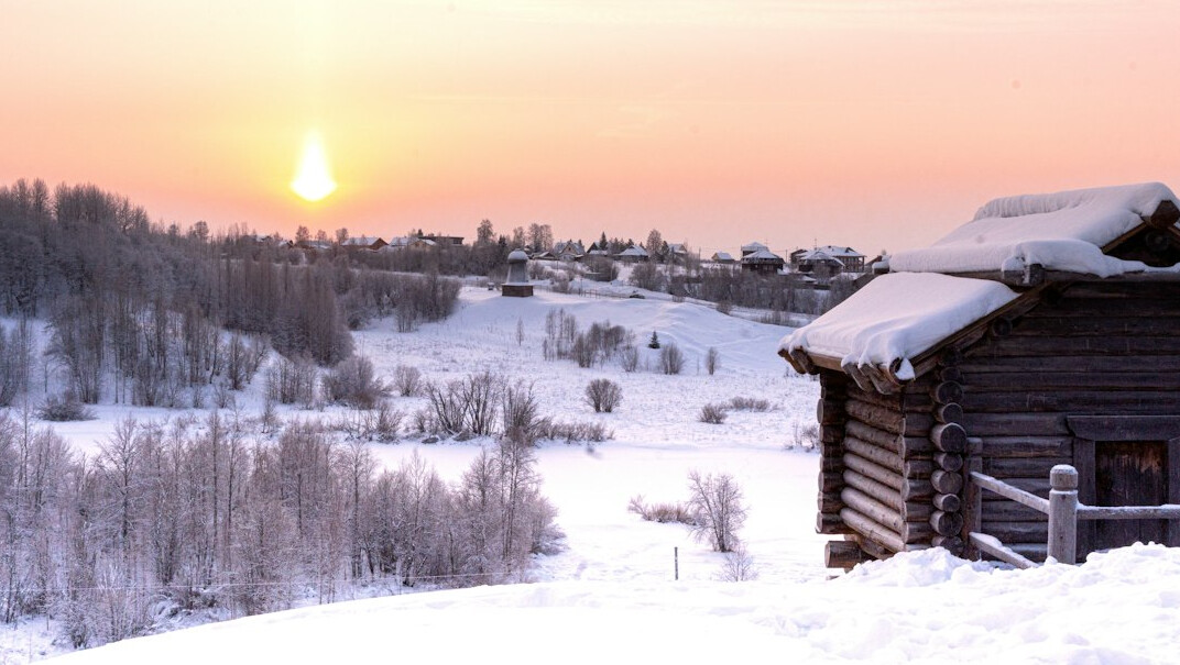 sunset over village